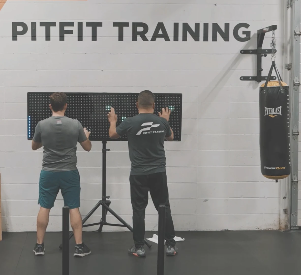 Two athletes training side by side on Reflexion Edge at PitFit Training